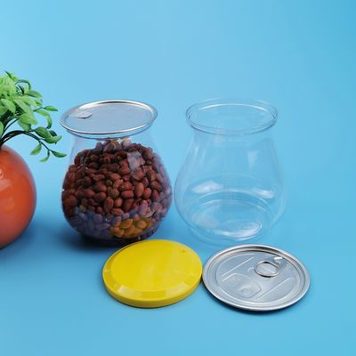 O vaso 900ML dá forma a latas plásticas do alimento com tampa macia do PE
